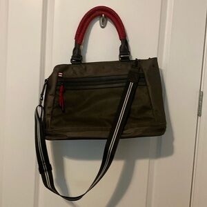 Olive green bag with red and black accents